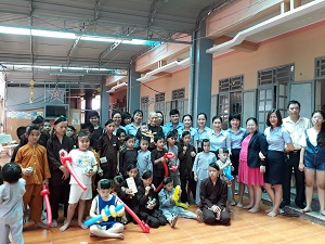 Presenting gifts to orphans living in Buddhist temple in Ba Ria-Vung Tau