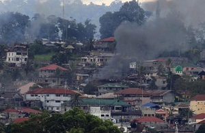 Philippine politician says residents report scores of bodies in embattled city