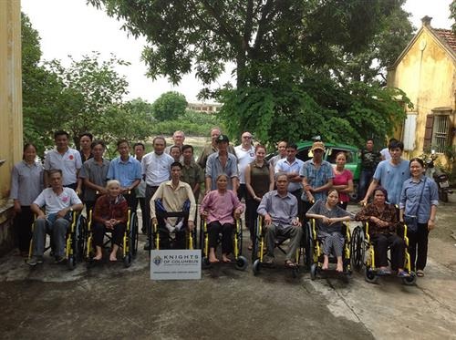 Caritas of Hanoi presents  wheelchairs to people with disabilities