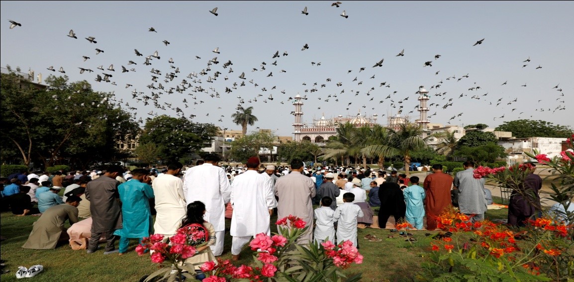Muslims mark Eid with masks and prayers amid COVID and conflict
