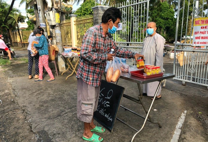 Zero-dong market for poor people set up by Buddhist pagoda in Tien Giang  